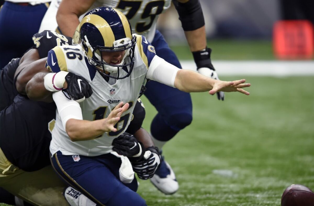 Rams quarterback Jared Goff fumbles during the first half of Sunday's game against New Orleans.