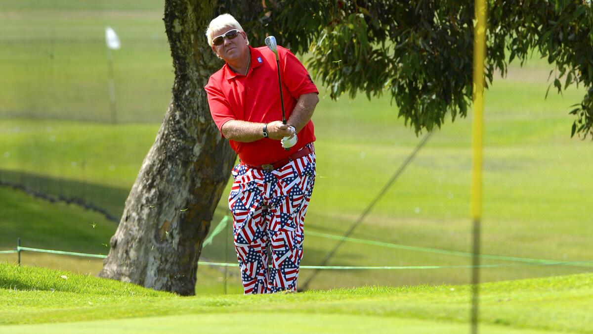 John Daly watches his pitch onto the first green during the first round of the Toshiba Classic on Friday at the Newport Beach Country Club.