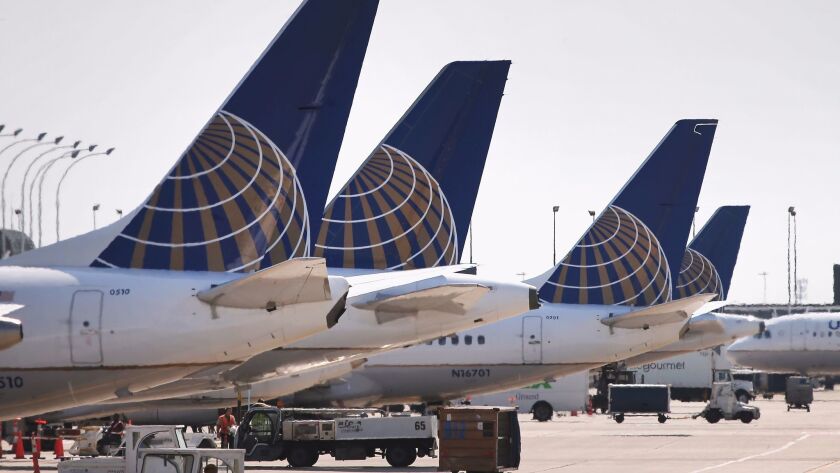 United Airlines jets at O'Hare International Airport in Chicago in 2014. The carrier plans to test a bidding program for dealing with overbooked flights.