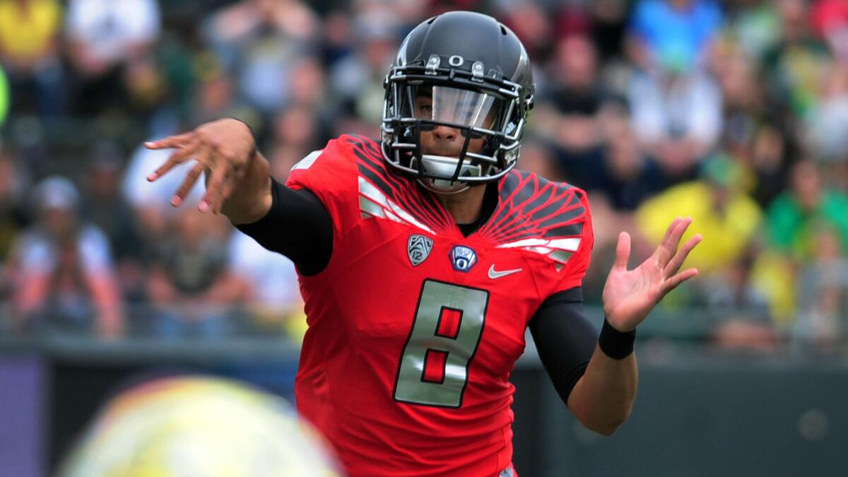 Oregon quarterback Marcus Mariota throws a pass during the team's spring game Saturday.