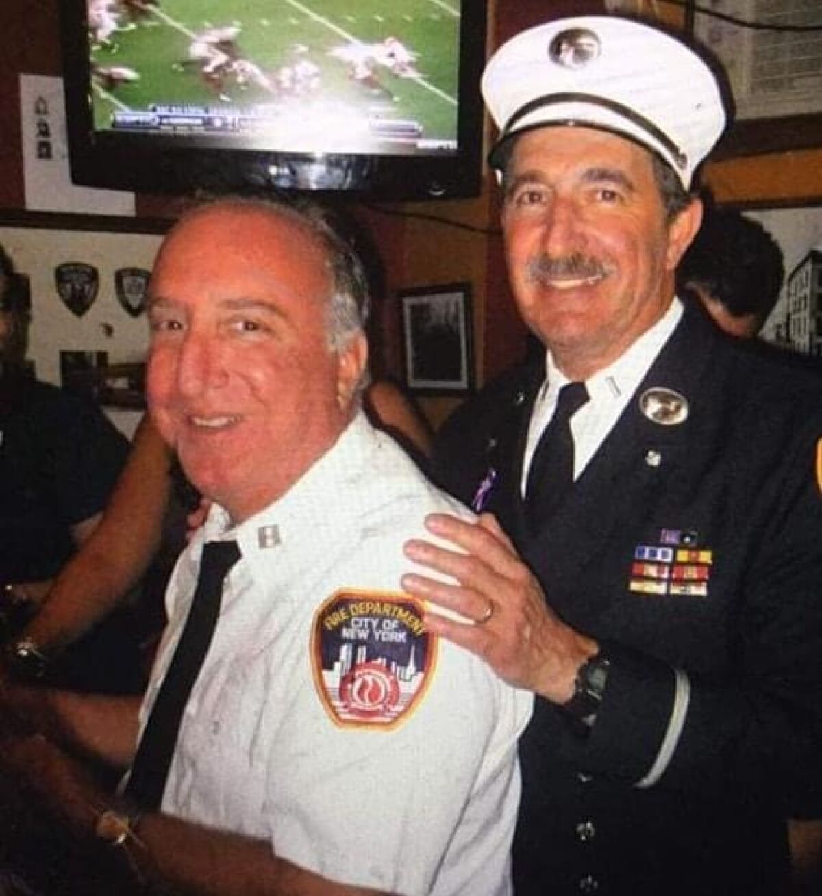 New York City Fire Department Capt. Ralph Gismondi, left, retired and became a JetBlue flight attendant.