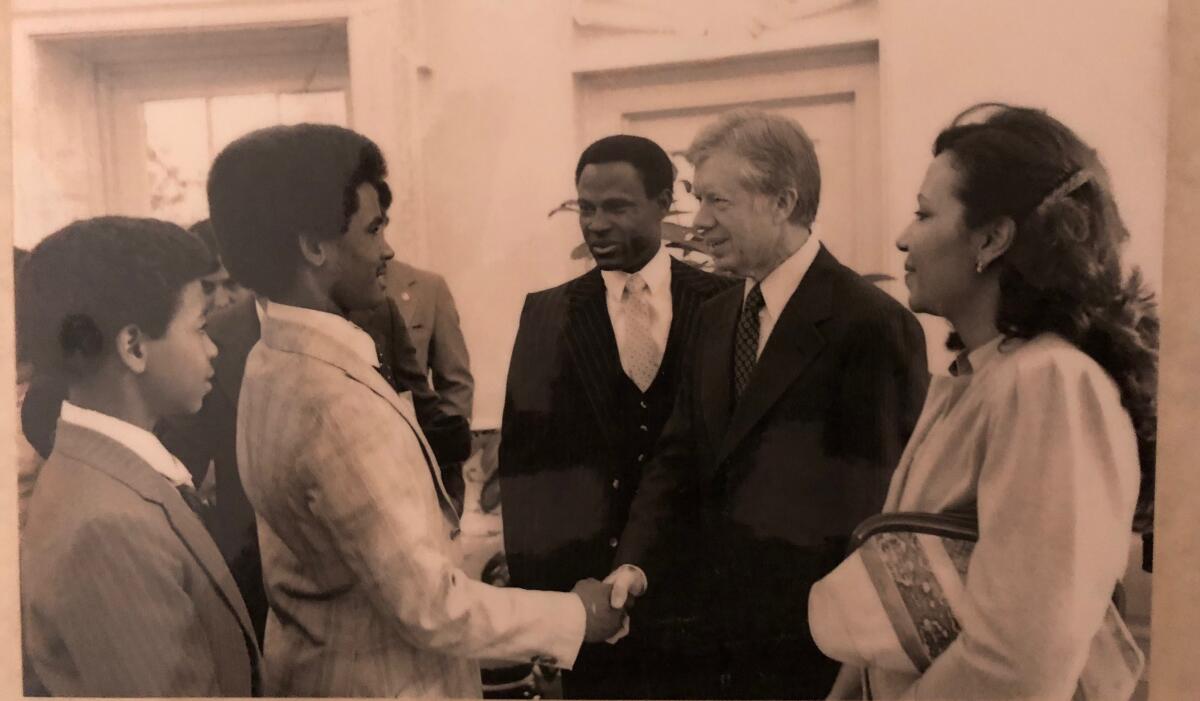 A young José Mota greets Jimmy Carter.