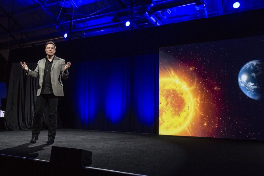 Elon Musk, CEO of Tesla Motors Inc., unveils the company's newest products, Powerwall and Powerpack energy storage devices, earlier this month.