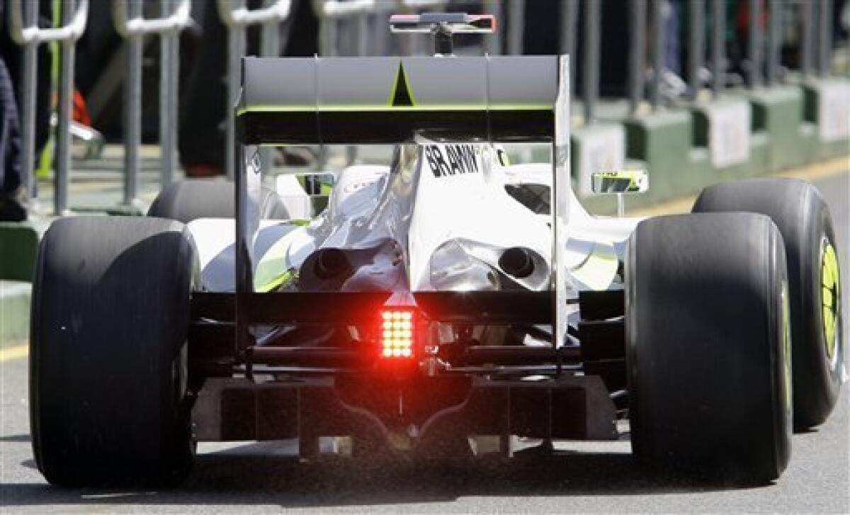 FILE - The March 27, 2009 file photo shows Brawn GP Formula One driver Jenson Button of Britain leaving the pit showing the controversial diffuser during the first timed practice session at the Australian GP in Melbourne. FIA ruled Wednesday, April 15, 2009 in Paris that disputed diffuser used by several Formula One teams is legal. (AP Photo/Rick Rycroft, file)
