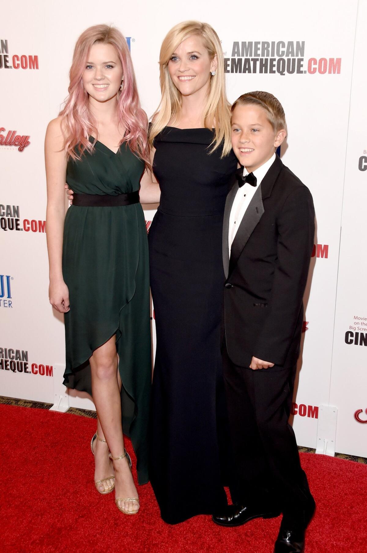 Reese Witherspoon is flanked by children Ava Phillippe and Deacon Phillippe at the 29th American Cinematheque Award honoring the actress on Friday in Los Angeles.
