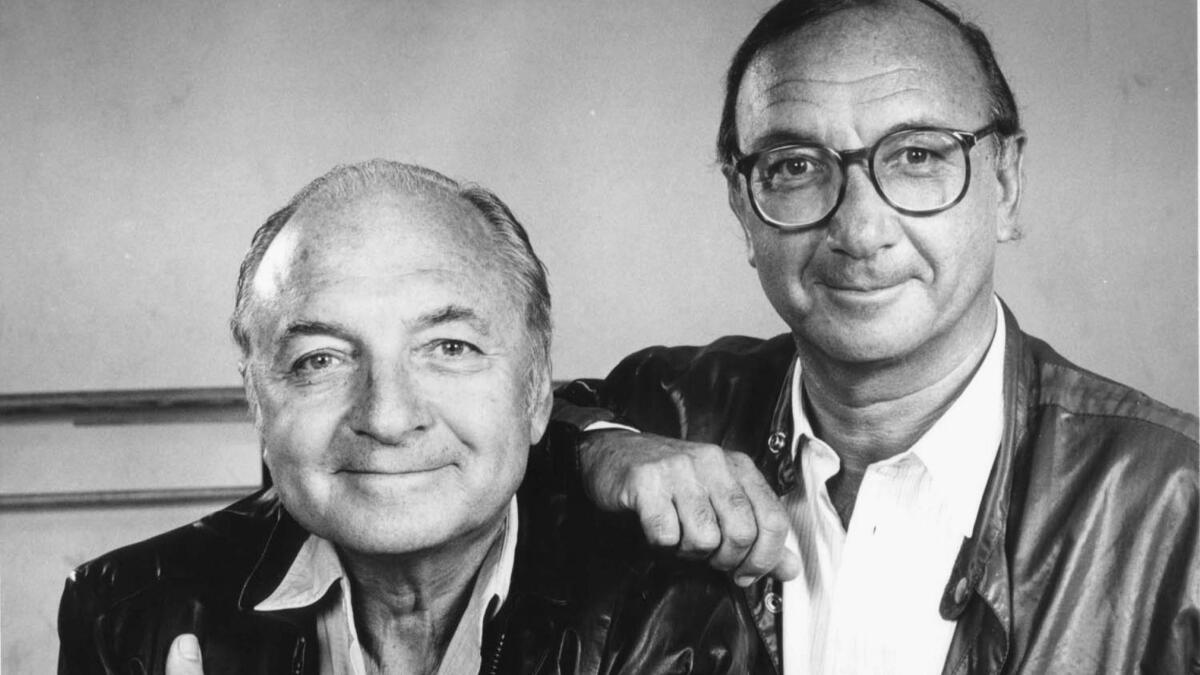 Neil Simon poses with his brother, comedy writer Danny Simon, in 1984.