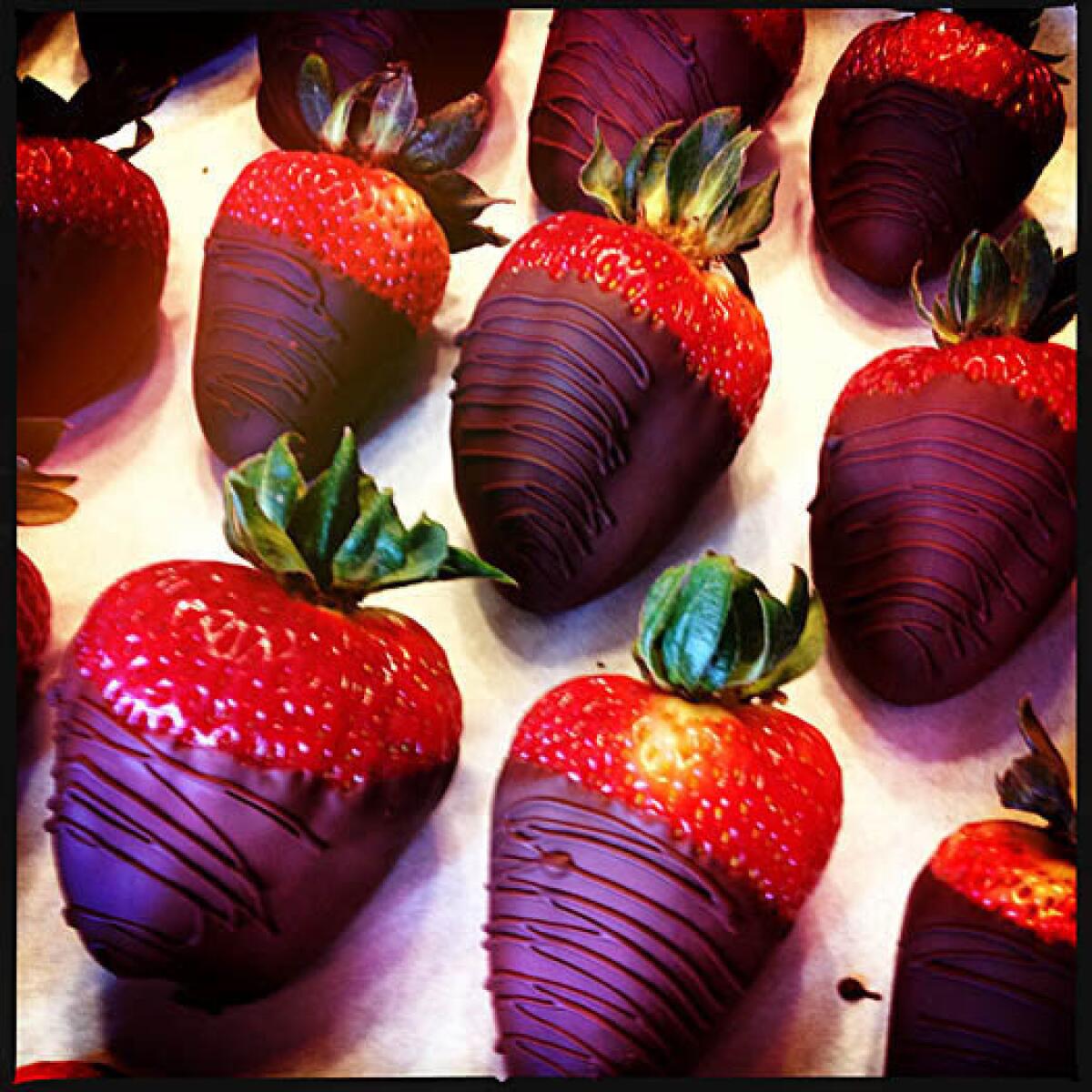 Chocolate-covered strawberries are photographed with an iPhone 4S.