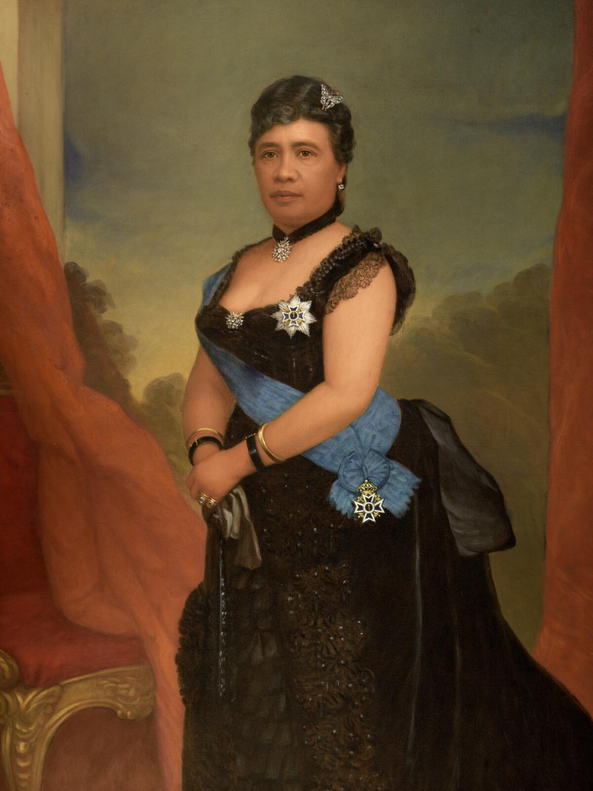 Queen Lili`uokalani, a native Hawaiian, wears a regal black Western dress with a sash in a painted 19th century portrait