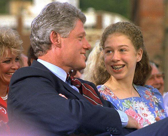 Presidential candidate Bill Clinton chats with 12-year-old daughter Chelsea before a rally in Hot Springs, Ark.