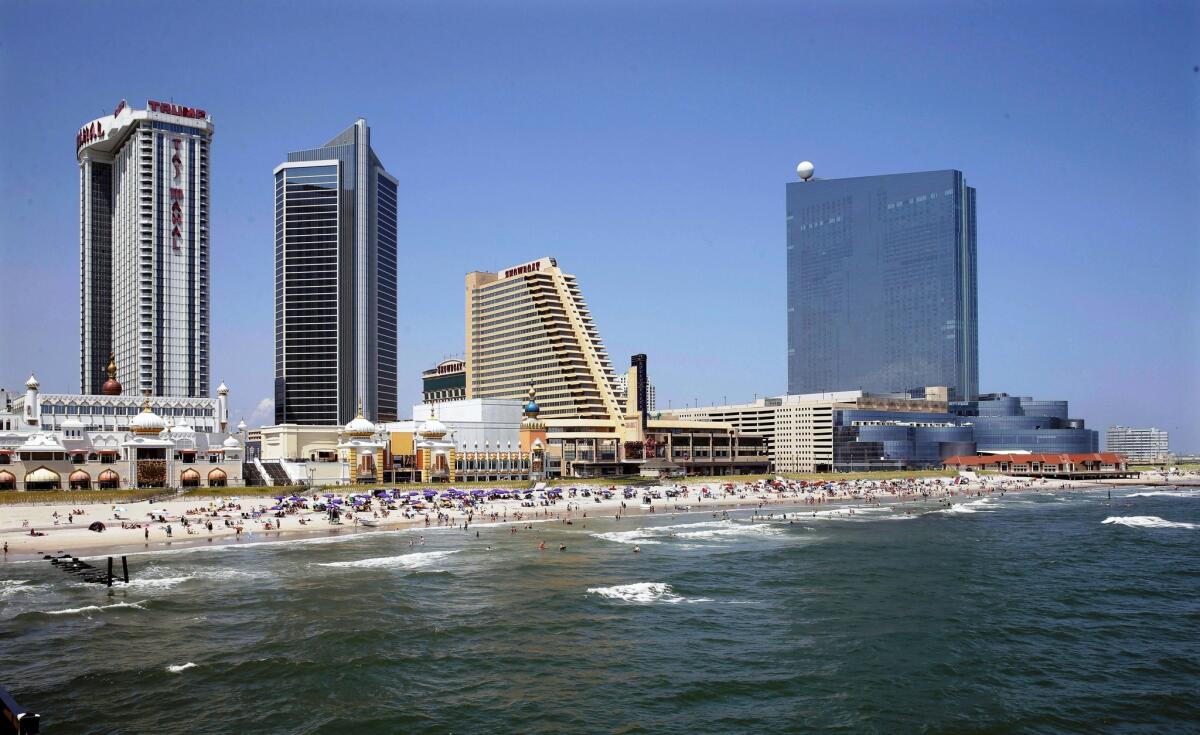 The Revel casino and hotel, right, rises in the distance at the far end of Atlantic City's boardwalk. The casino announced it would close by Sept. 10, two years after opening.