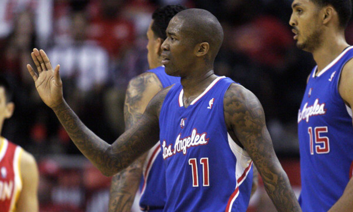 Clippers guard Jamal Crawford celebrates a basket during a win over the Houston Rockets on Saturday. A sore Achilles' tendon could sideline Crawford until the playoffs.