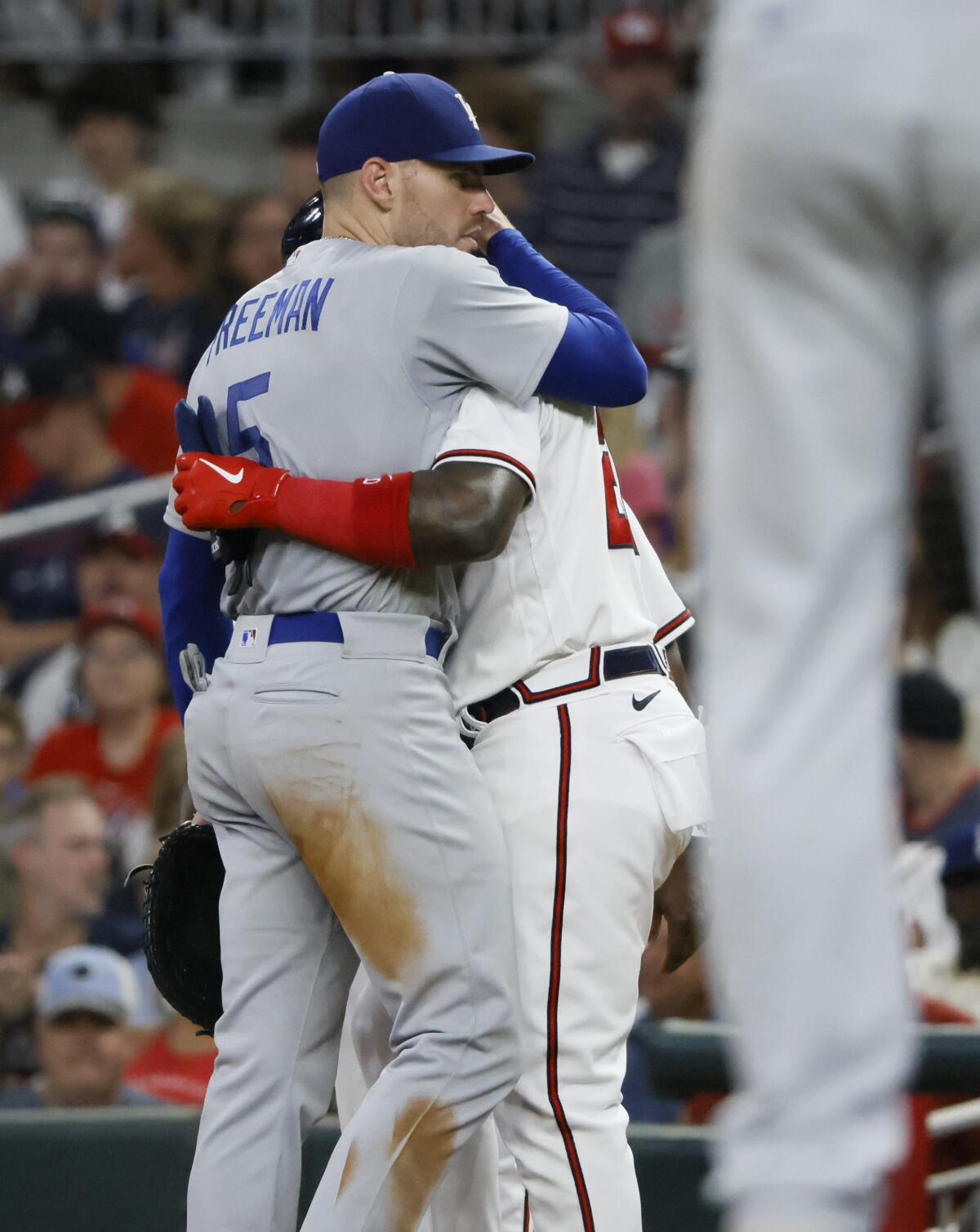 Freddie Freeman hugs former Braves teammate Marcell Ozuna during a game June 25 in Atlanta.