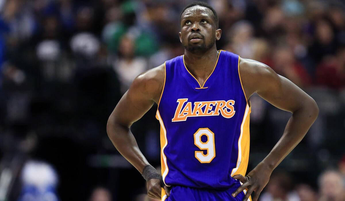 Lakers forward Luol Deng walks toward the bench during the second half against the Dallas Mavericks on Jan. 22.