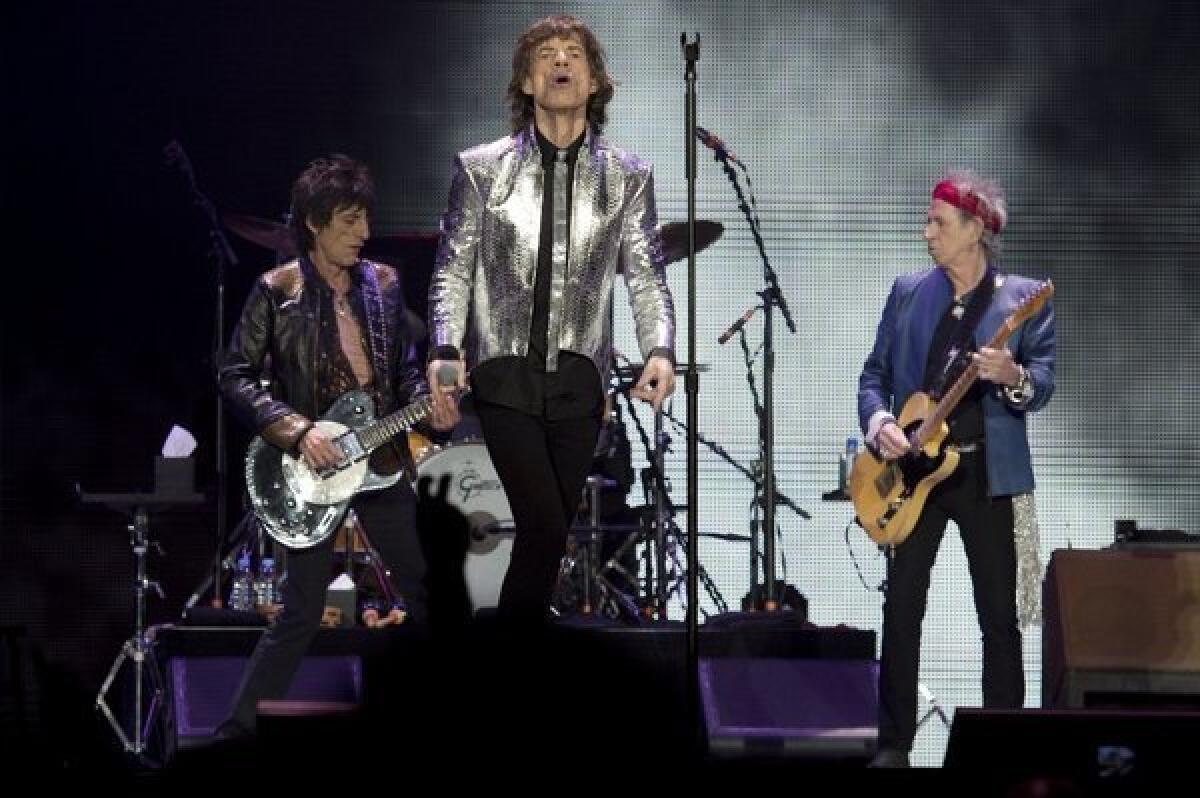 Rolling Stones Ron Wood, left, Mick Jagger and Keith Richards perform at a concert in London on Nov. 29, 2012, marking the iconic British band's 50th anniversary.