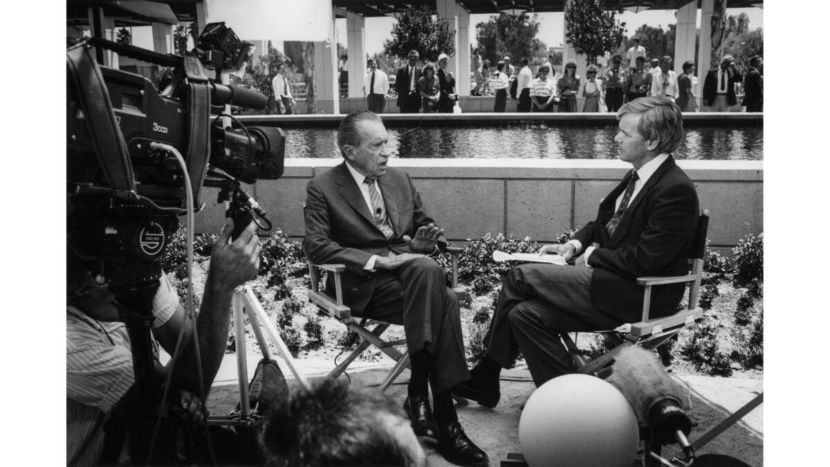 July 19, 1990: Camera's roll as former President Nixon is interviewed by NBC's Tom Brokaw by the reflecting pool at the Nixon Library.