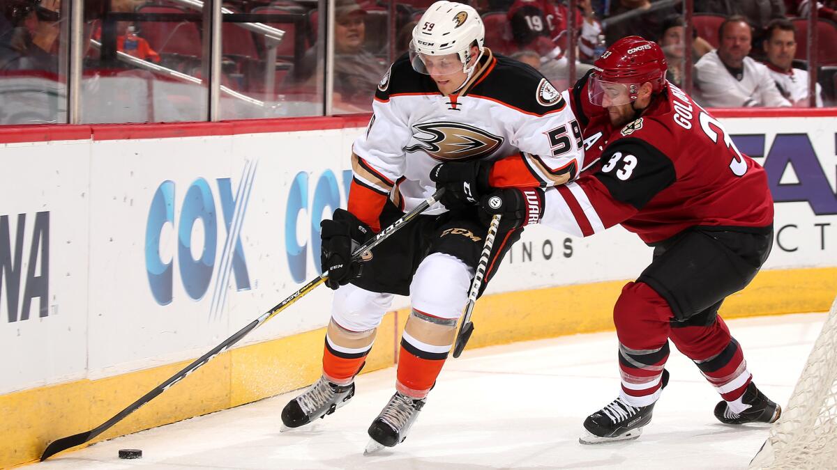 Ducks winger Nick Sorensen tries to elude Coyotes defenseman Alex Goligoski with the puck during the second period Saturday.