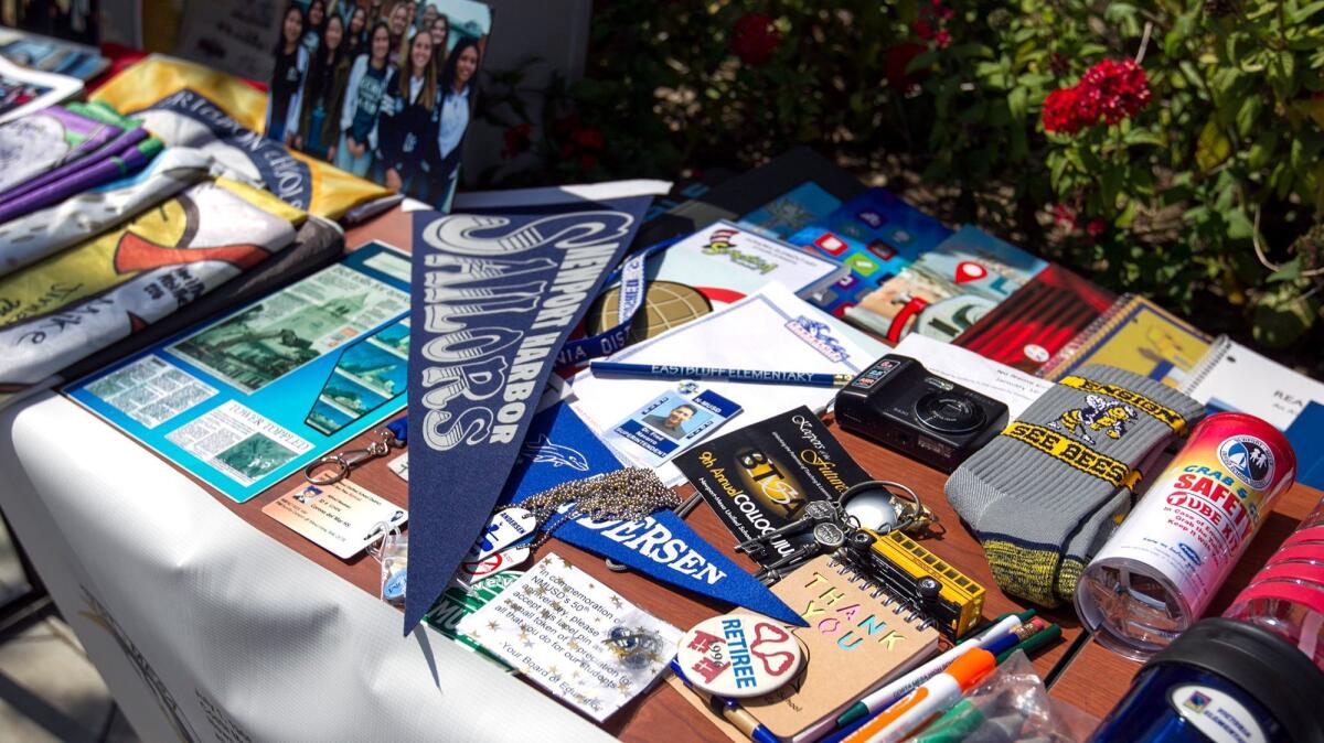 Items are displayed that will be placed in a time capsule during an event at the Newport-Mesa Unified School District offices on Friday.