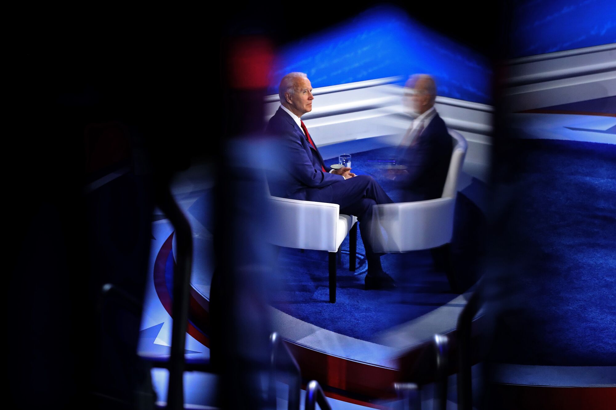 Joe Biden sits onstage
