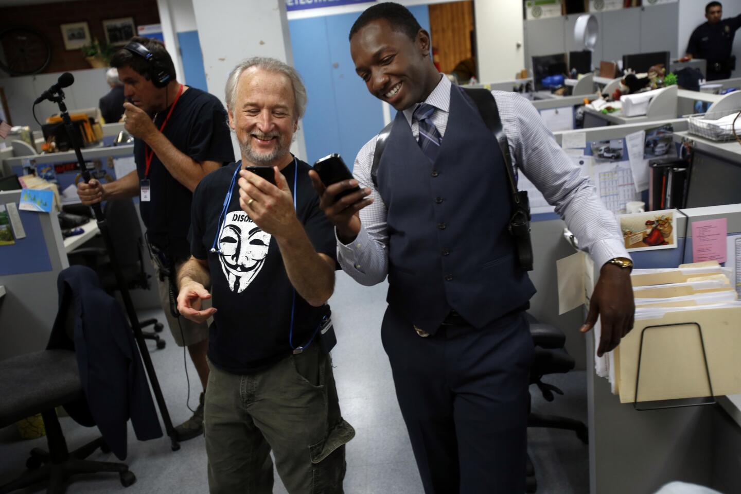 Kevin Dowling, left, and Jamie Hector, who plays a homicide detective, take a cellphone photo on the set of the Amazon series.