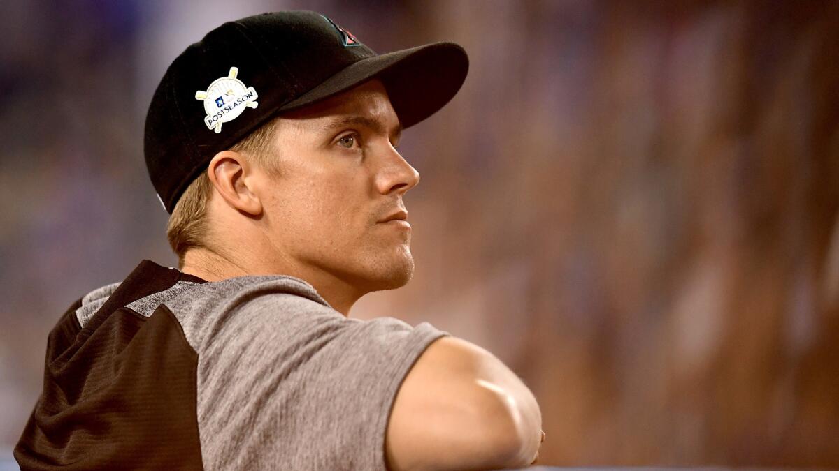Diamondbacks pitcher Zack Greinke looks on from the dugout while taking on the Dodgers during Game 1 of the National League Division Series.