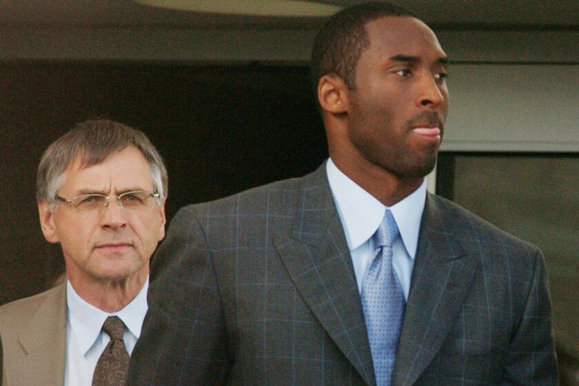 Kobe Bryant and attorney Hal Haddon leave the Eagle County Justice Center after the third day of jury selection for the trial on sexual assault charges.