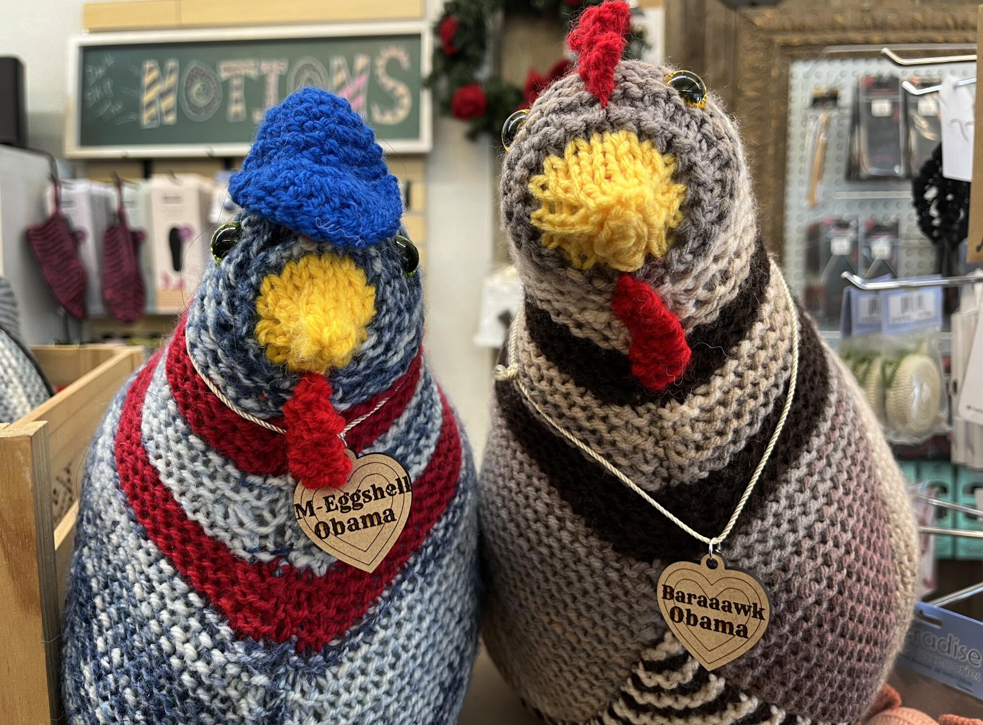 Two knitted and stuffed chickens with name tags: M-eggshell Obama and Baraaawk Obama