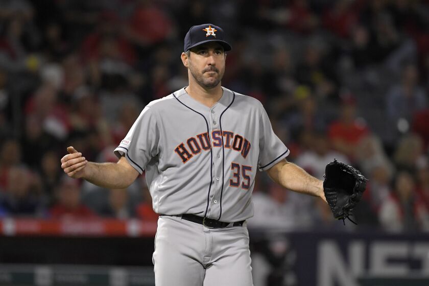 Houston Astros' Justin Verlander celebrates after completing 300 season strikeouts during the sixth inning of a baseball game against the Los Angeles Angels Saturday, Sept. 28, 2019, in Anaheim, Calif. (AP Photo/Mark J. Terrill)