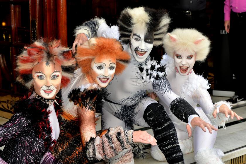 Members of the new London cast of "Cats" strike feline poses.