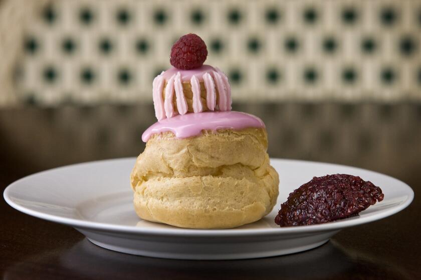 The choux pastry is filled with raspberry pastry cream and decorated with fondant. Recipe: Raspberry religieuse