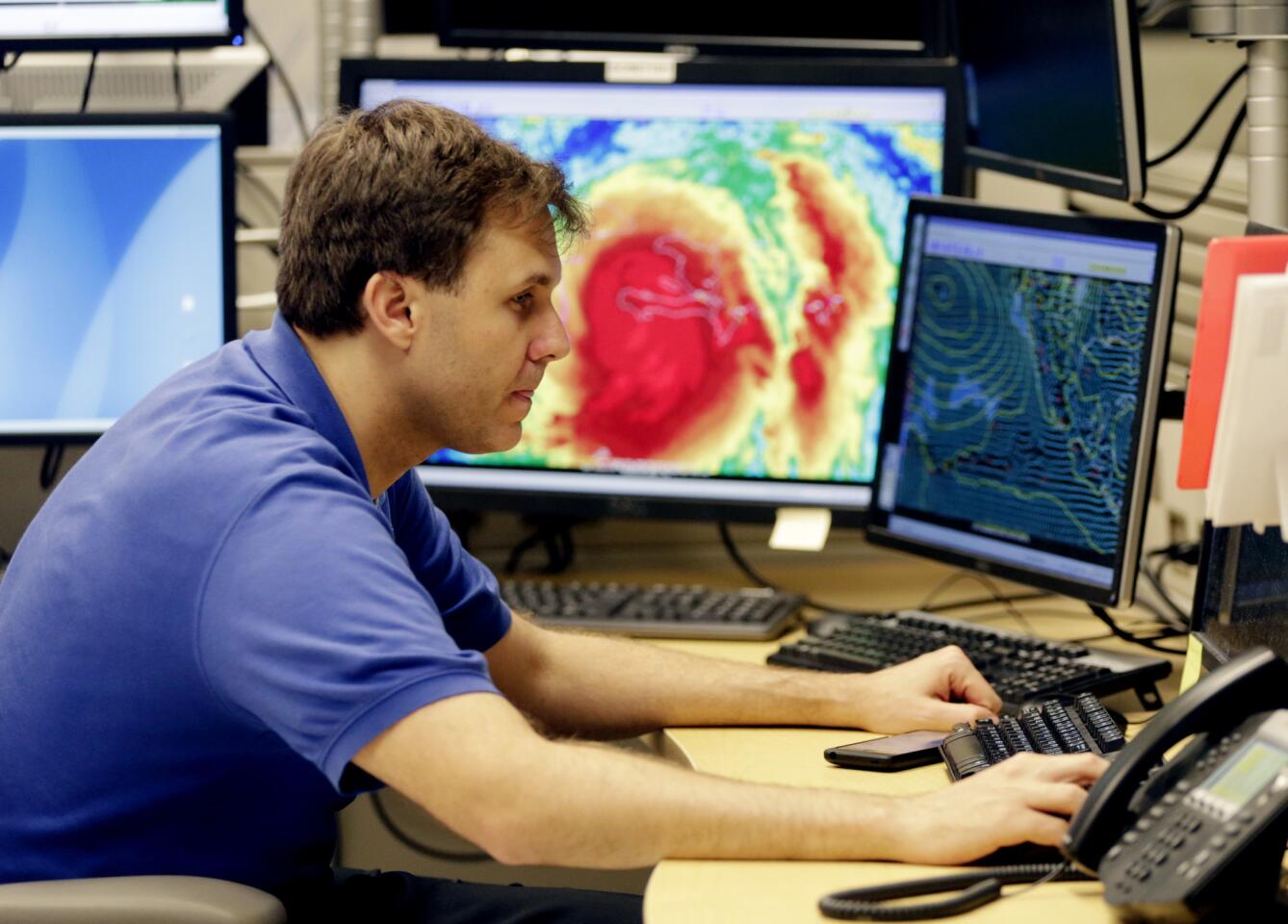 Hurricane specialist Eric Blake monitors the path of Hurricane Matthew at the National Hurricane Center in Miami on Oct. 4, 2016.