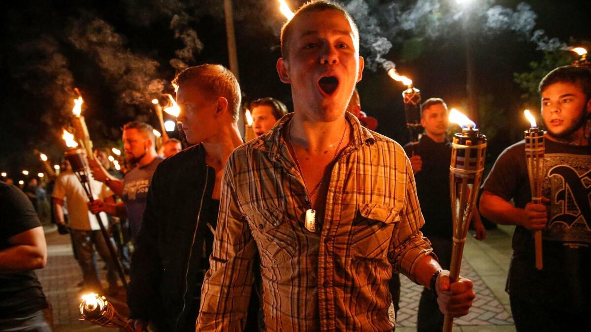 On Friday, multiple white nationalist groups march with torches through the University of Virginia campus in Charlottesville, Va.