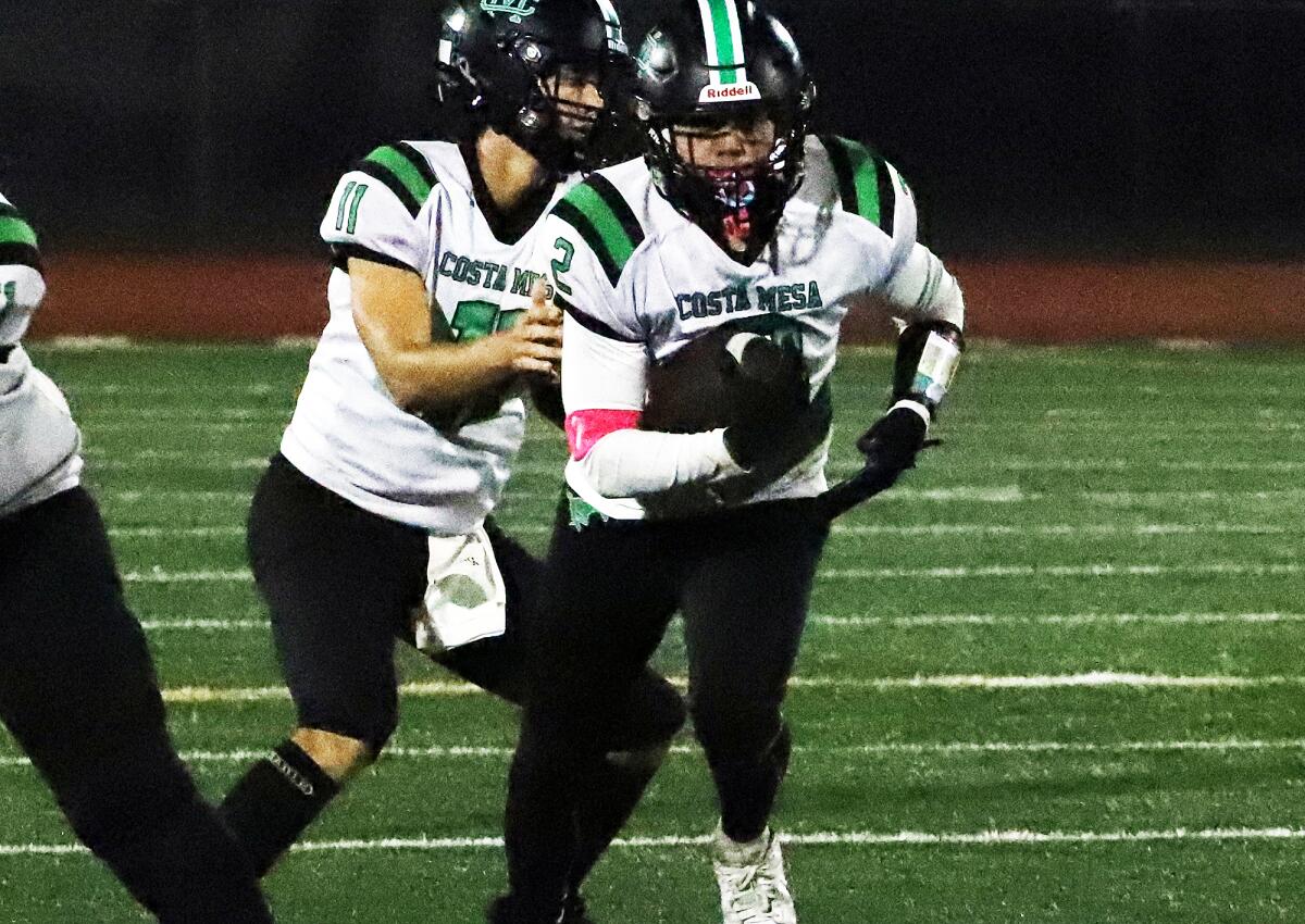 Costa Mesa's Jose Lopez (2) rushes through the middle against Bolsa Grande in a Tango League game on Thursday.