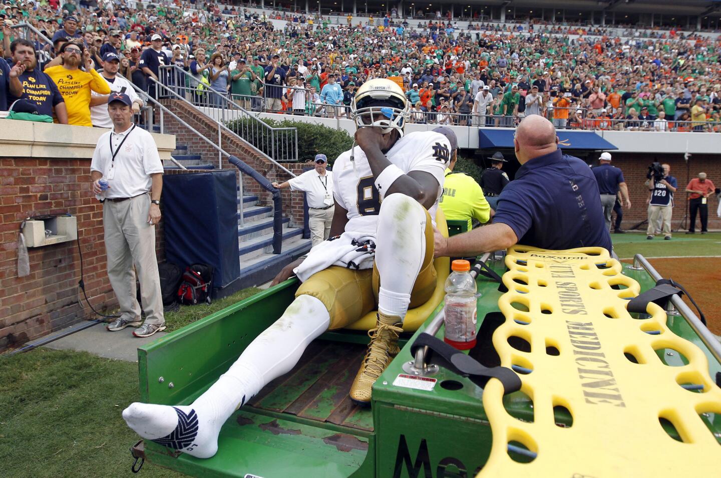 Notre Dame quarterback Malik Zaire is driven off the field after fracturing his right ankle during the third quarter. He will be out for the rest of the season.