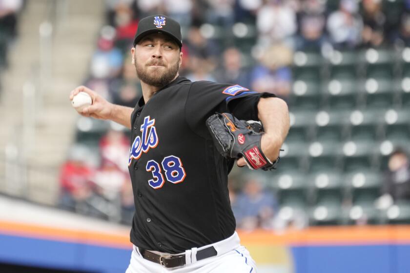 New York Mets pitcher Tylor Megill delivers against the Philadelphia Phillies during the first inning of the first game of a baseball doubleheader, Saturday, Sept. 30, 2023, in New York. (AP Photo/Mary Altaffer)