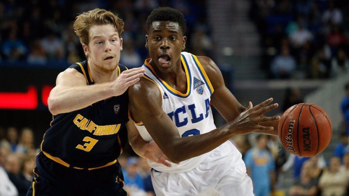 UCLA guard Aaron Holiday drives against California guard Grant Mullins during a game at Pauley Pavilion on Jan. 5.