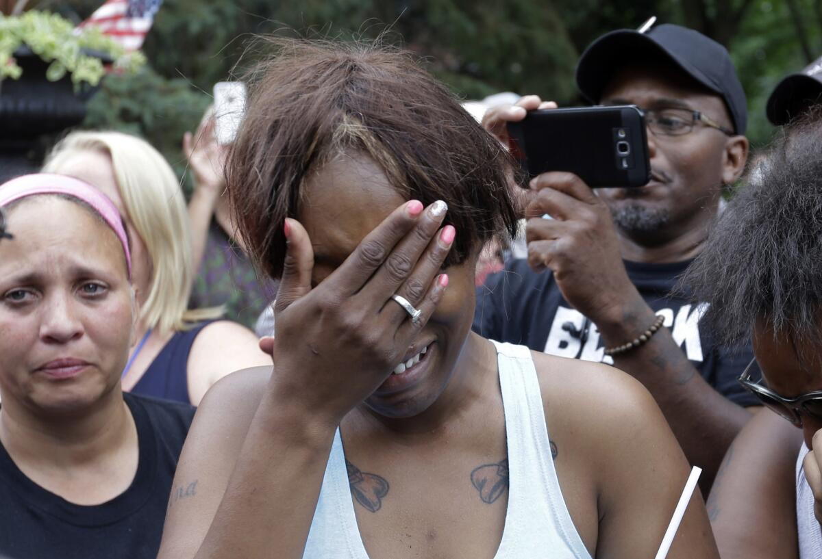 Diamond Reynolds, the girlfriend of Philando Castile, cries outside the governor's residence in St. Paul, Minn.
