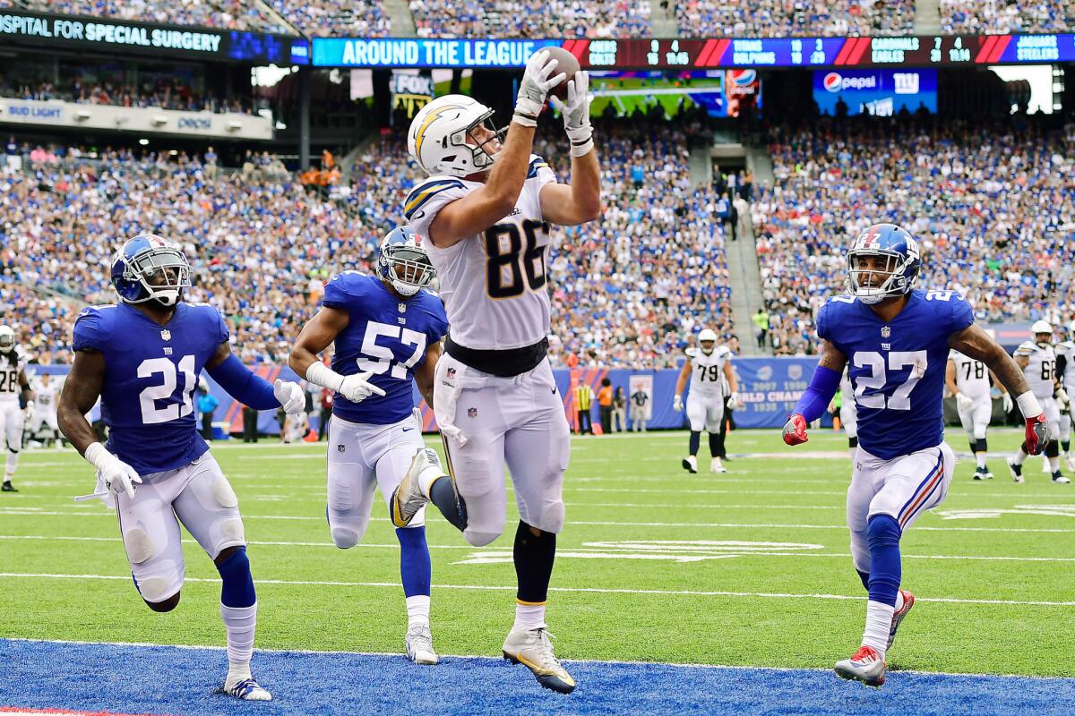 Chargers tight end Hunter Henry catches a touchdown pass behind the Giants defense during the third quarter of their Oct. 8 game.