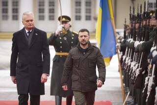 In this photo provided by the Ukrainian Presidential Press Office, Lithuania's President Gitanas Nauseda, left, and Ukrainian President Volodymyr Zelenskyy attend a welcoming ceremony in Presidential Courtyard, Vilnius, Lithuania, Jan. 10, 2024. Volodymyr Zelenskyy is on his trip to Baltic countries that started in Lithuania. (Ukrainian Presidential Press Office via AP)