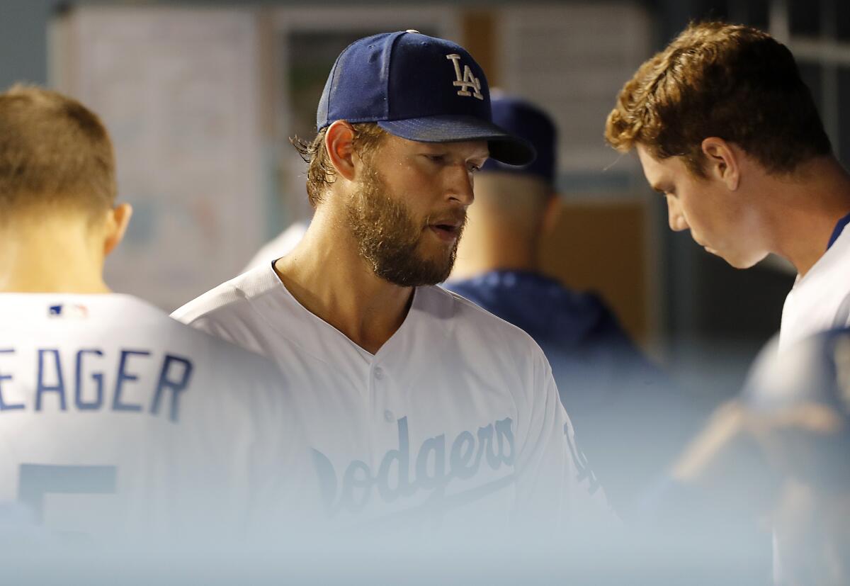 Dodgers starter Clayton Kershaw returns to the dugout.