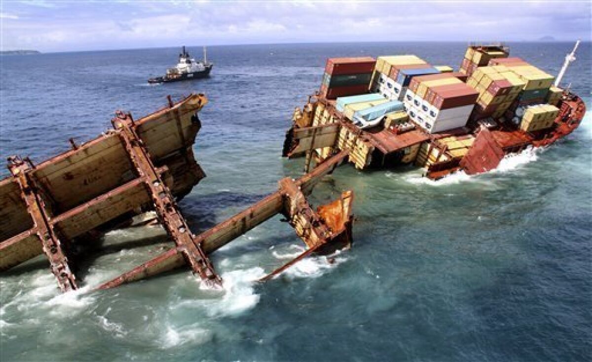 In this photo provided by Maritime New Zealand, half of the cargo ship Rena sinks on a reef near Tauranga, New Zealand, Tuesday, Jan. 10, 2012. The 774-foot (236-meter) vessel split in two over the weekend amid heavy seas and now the stern section is slipping from the Astrolabe reef and sinking. (AP Photo/Maritime New Zealand, Graeme Brown) EDITORIAL USE ONLY
