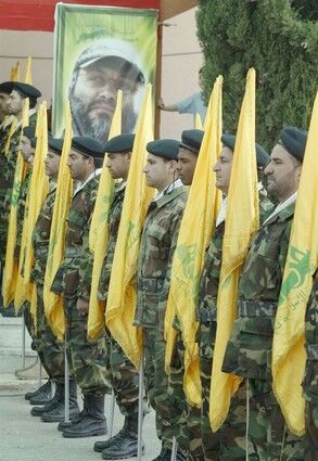 Hezbollah fighters hold a ceremony for Imad Mughniyah, who was slain in a bombing in Damascus that was blamed on Israel. He was wanted by the West in terrorist attacks.