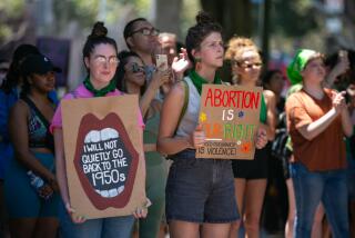 LOS ANGELES, CA - JUNE 26: Protesters gather in Grand Park at a rally organized by The Feminist Front and Generation Ratify protesting the U.S. Supreme Court's decision to overturn federal abortion protections provided under Roe v. Wade on Sunday, June 26, 2022 in Los Angeles, CA. (Jason Armond / Los Angeles Times)