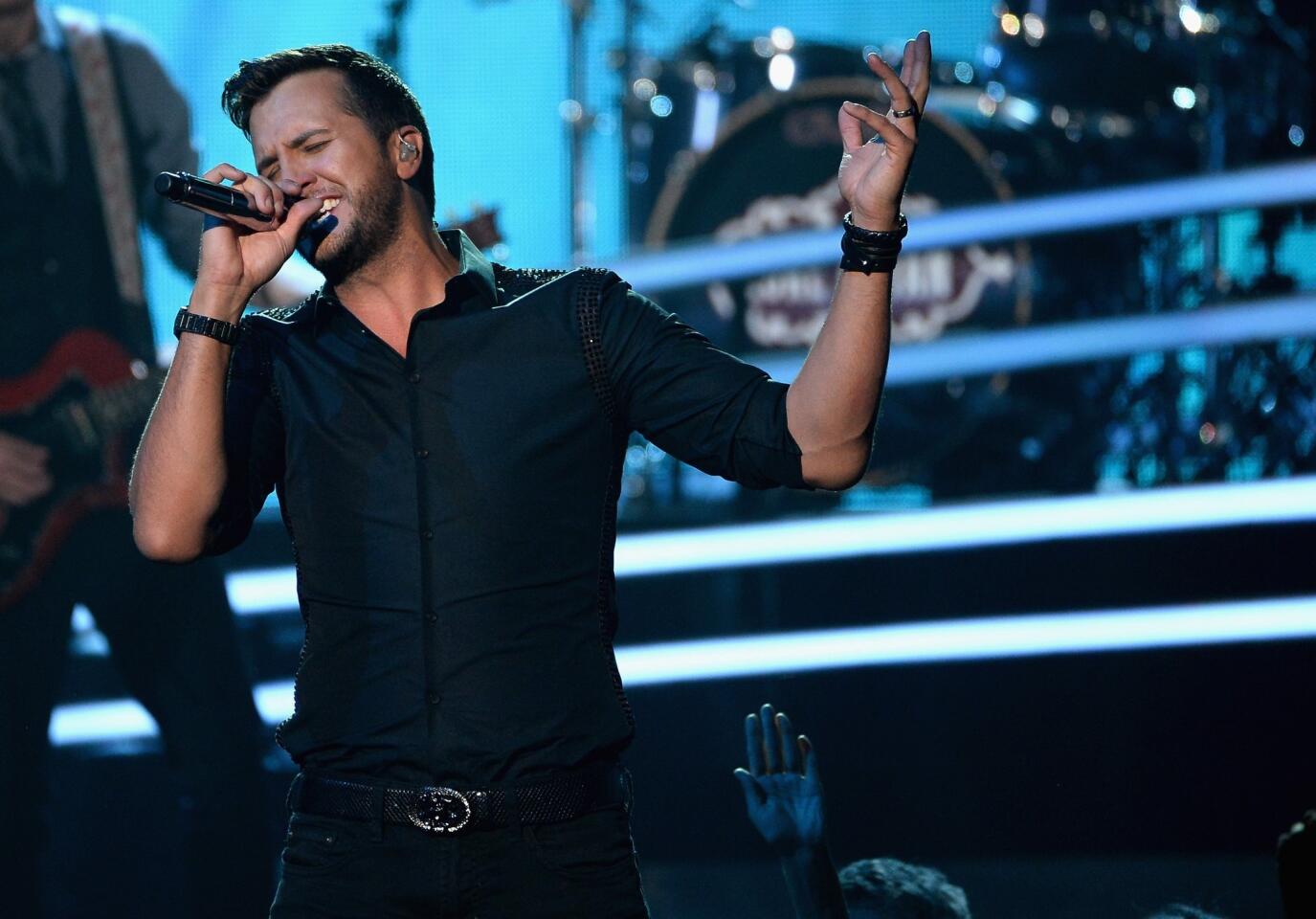 Luke Bryan falls off stage, unscathed