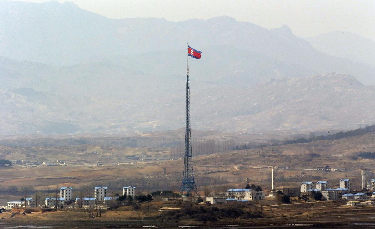 A North Korean flag is seen atop a 533-foot-tall tower in the village of Gijungdong, near the north side of the border village of Panmunjom.