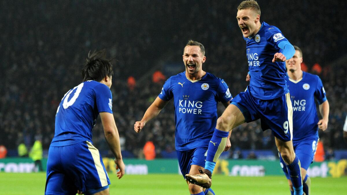 Leicester’s Shinji Okazaki, left, celebrates with teammates Jamie Vardy, leaping, and Daniel Drinkwater after scoring against Newcastle during an EPL game on March 14.