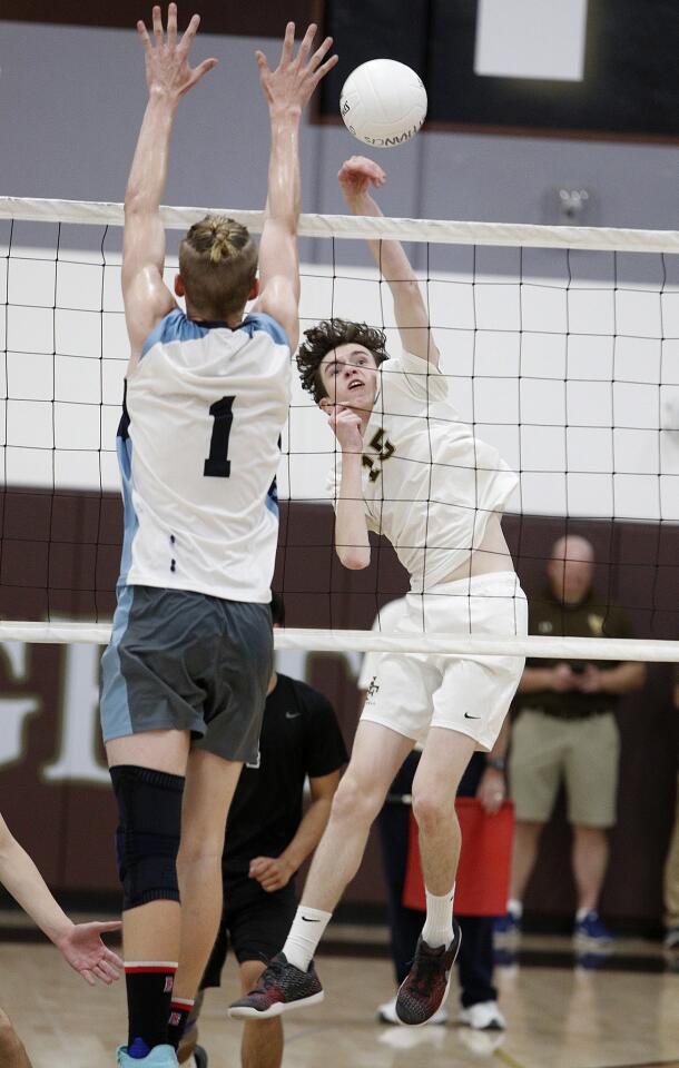 St. Francis' Gus Maltzan hits a kill against Quartz Hill's Nathan Merren in a CIF Southern Section Division II second-round boys' volleyball match on Thursday, May 10, 2018. Quartz Hill defeated St. Francis 3-0.