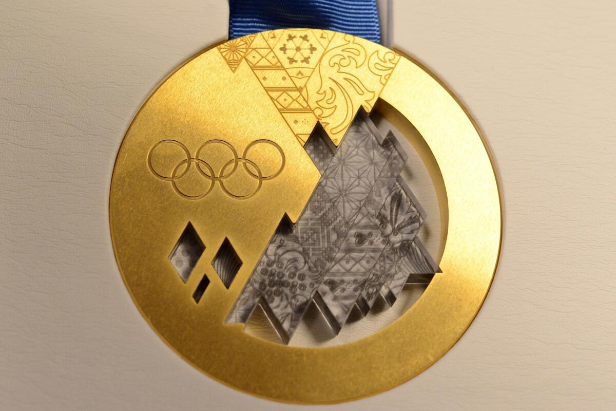 The gold medal for the 2014 Sochi Games features a patchwork quilt design representing Russia's different regions.
