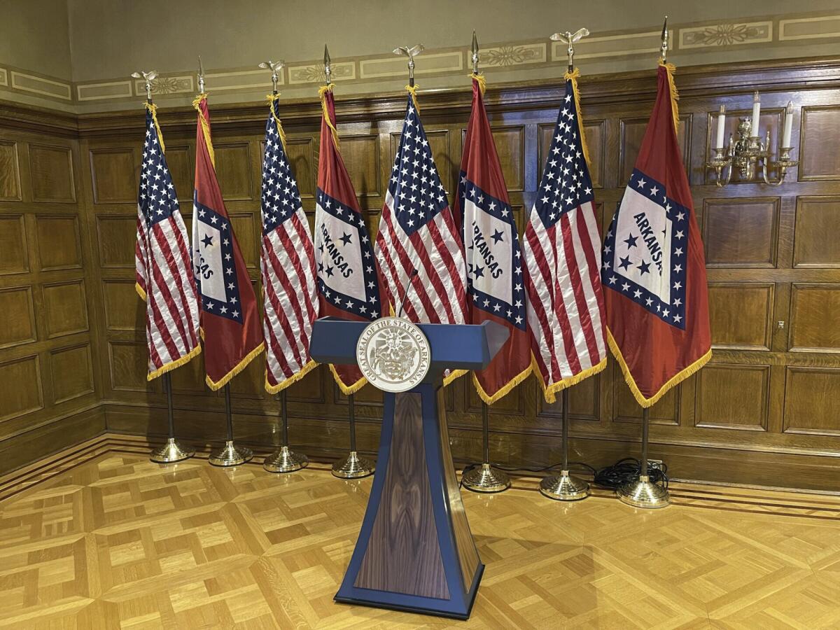 A blue and wood-paneled lectern sits in the governor's conference room at the Arkansas State Capitol on Tuesday, April 16, 2024. An audit requested by lawmakers said the $19,000 lectern purchased for Gov. Sarah Huckabee Sanders' office potentially violated several state laws. Sanders' office has disputed the audit's findings and called the audit deeply flawed. (AP Photo/Andrew DeMillo)