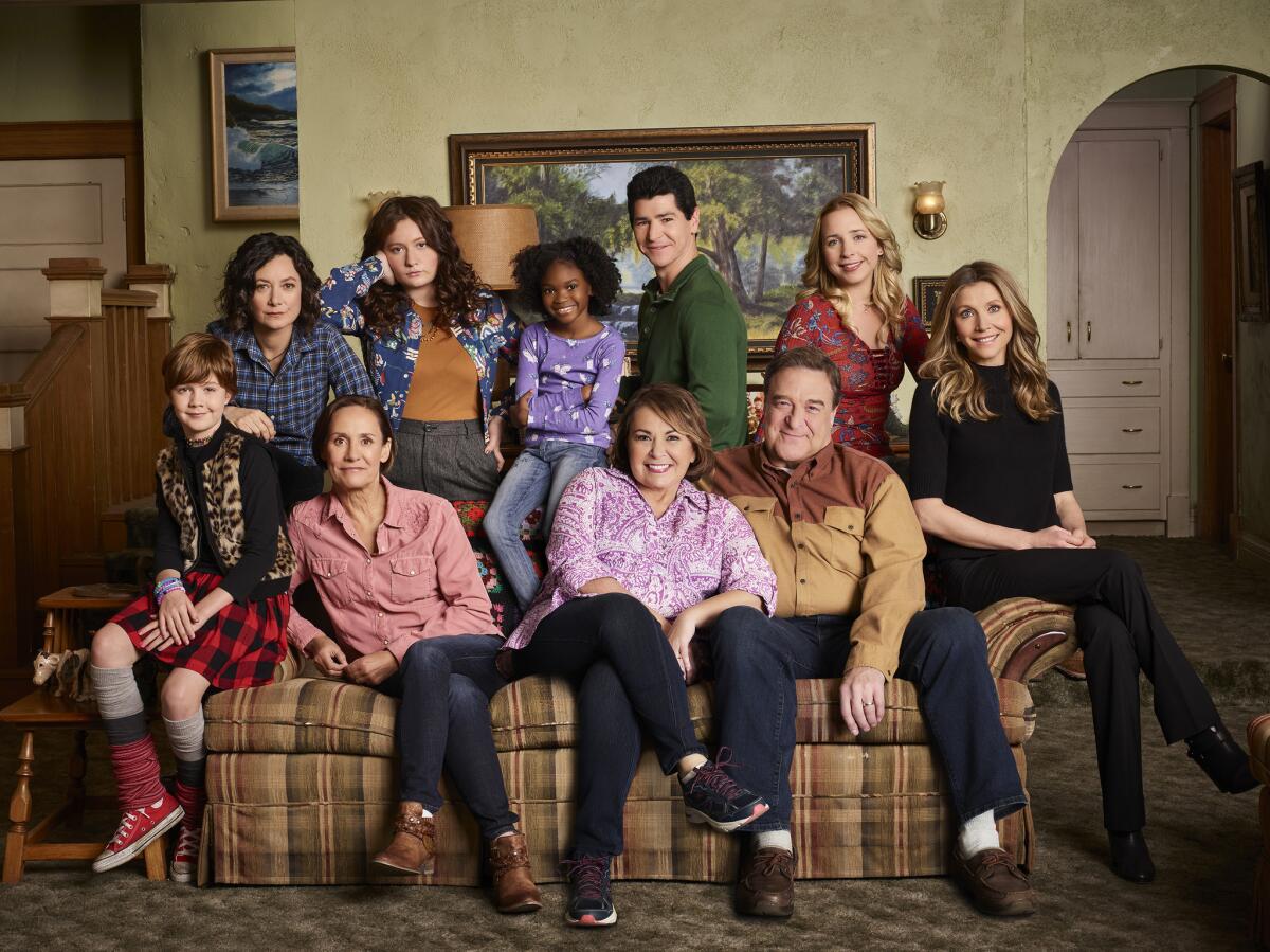 The cast of ABC’s “Roseanne” in happier days, before the network canceled the series.