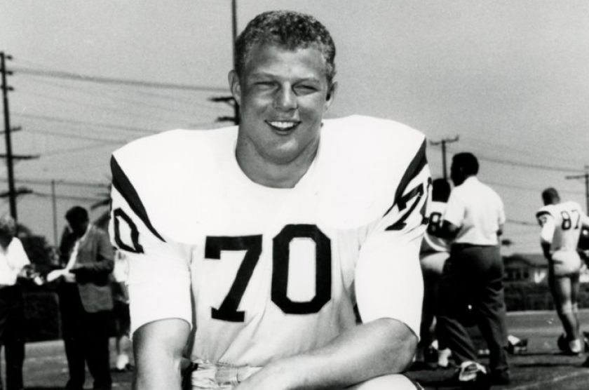 A USC helmet sits on the bench.